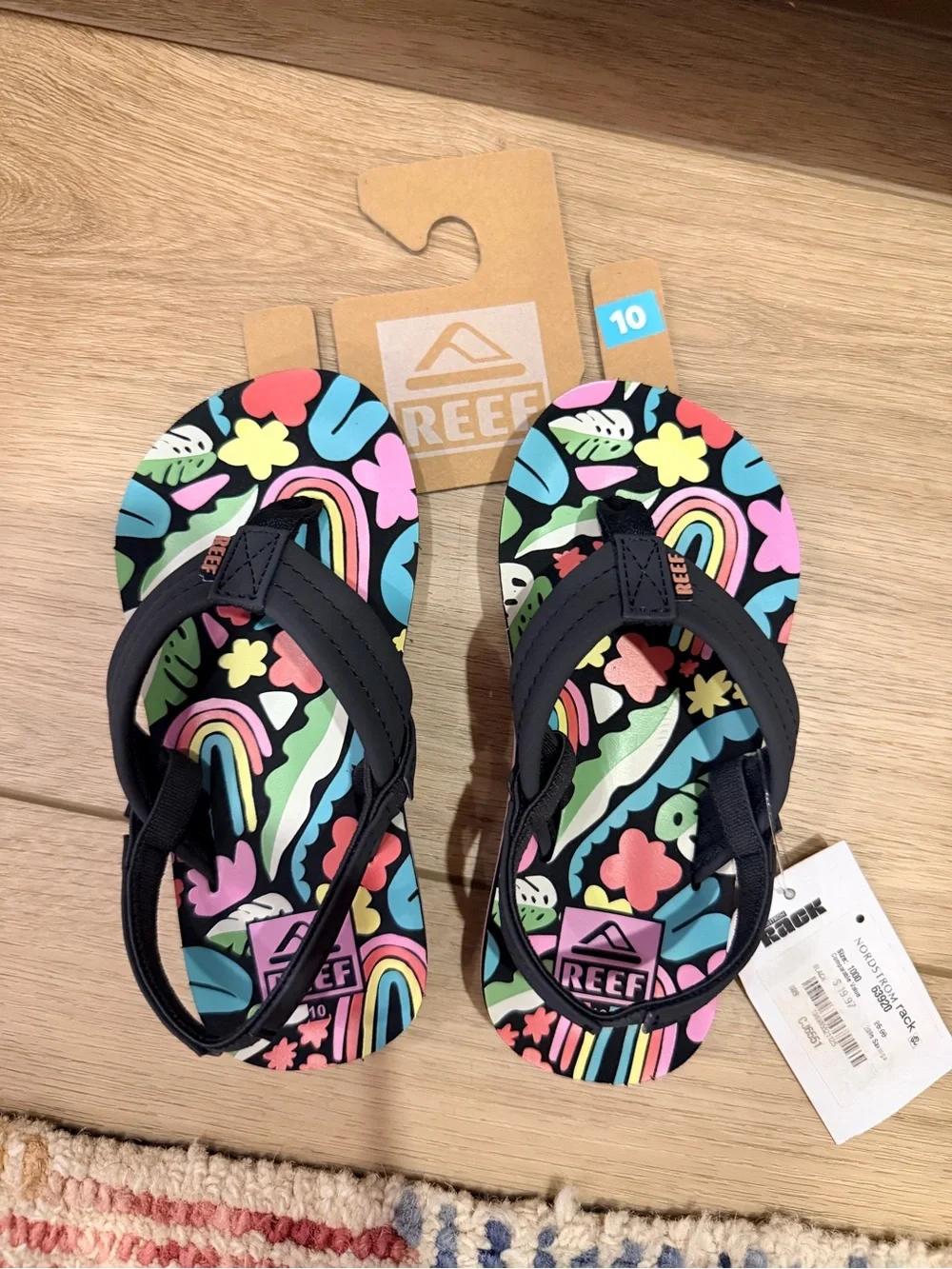 Reef Kids Black Flip Flops with Pink and Multicolor Floral Rainbow Print